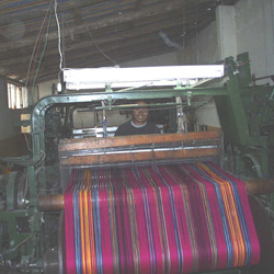 Weaving the cloth.
